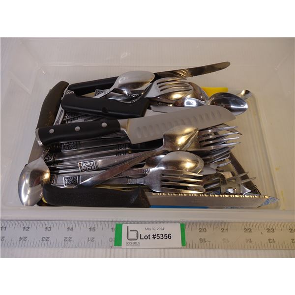Plastic Container full of Silverware and knives