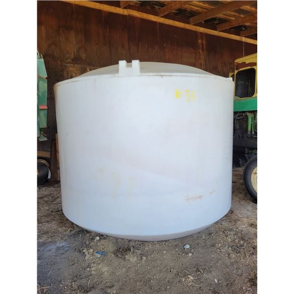 Approx. 1200-gal white poly tank c/w valve