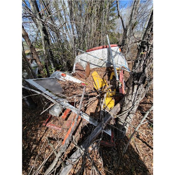 Toyota truck c/w misc. iron in the trees