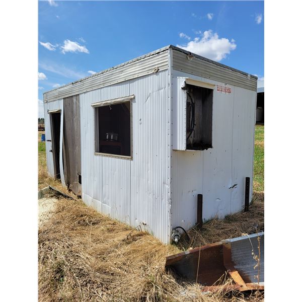Skid shack (needs repair) c/w contents