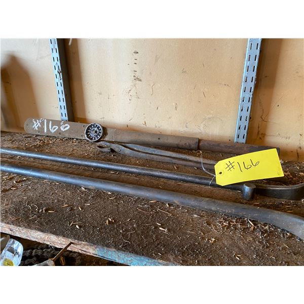 Pry & tire bars, old snap on torque wrench. 300 ft tape, 2 pouches, first aid etc.