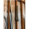 Image 2 : Exhaust hose, chains, 2 red hyd. rams, air hose, rain jackets, rope. All items on north wall.