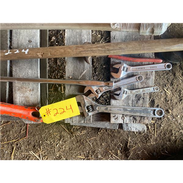 4- Crescents, flex bar, pipe wrench, new sythe, sledge hammer]