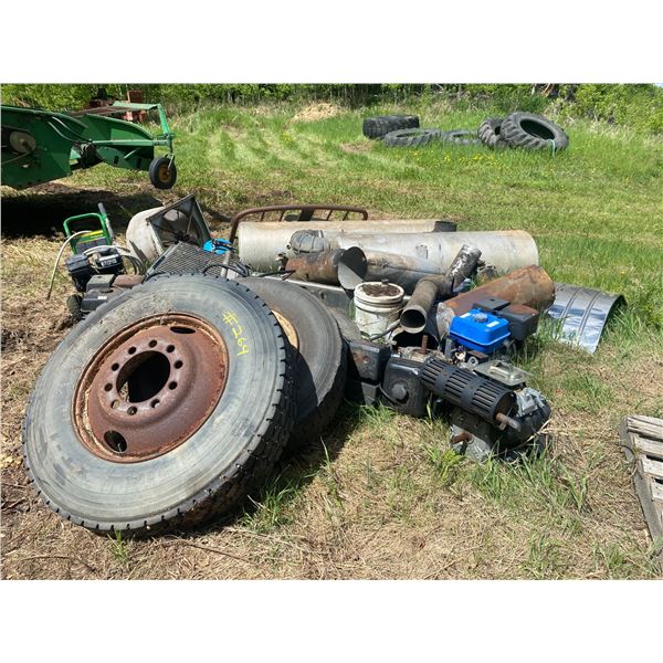 Pile of motors, tires, fuel tanks