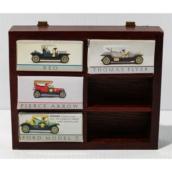 FOUR COLLECTIBLE MINI CARS IN WALL HANGING DISPLAY