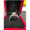 Image 2 : 2.15 CT ROUND CUT GREENISH BLUE MOISSANITE WITH 48 ROUND CUT CUBIC ZIRCONIUM WEIGHING A TOTAL 0.40 C