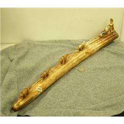 Dog team mounted on fossilized ivory tusk, dogs of bone, man of fossilized ivory, sled has ivory sea