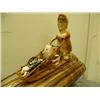Image 2 : Dog team mounted on fossilized ivory tusk, dogs of bone, man of fossilized ivory, sled has ivory sea