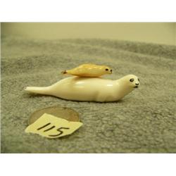 Ivory seal with fossilized ivory seal pup on back 2.75" long .75" tall (33)
