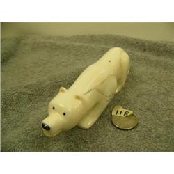 Carved ivory polar bear with inset baleen eyes and nose by H.B. Slwooko 1.75" tall 6.25" long (33)