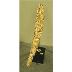 Fossilized ivory carvings of approx. 29 seals, walruses, whales and fish mounted on marble 18.5" lon