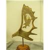Image 6 : Moose antler carved with eagle's head and center carved with eagle with salmon mounted on wood by B.