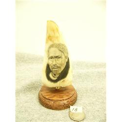 Whale tooth scrimshawed with a Eskimo man's face mounted on wood by H.S.K. 5.25" (33)