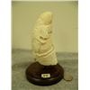 Image 1 : Whales tooth carved with polar bear preparing to swat a seal mounted on wood 6.5" tall (33)
