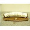 Image 1 : Ivory scrimshawed with two sailing ships, lighthouse, houses and man navigating mounted on wood with