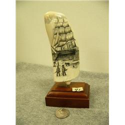 Whales tooth scrimshawed with sailing ship and whale and harpoon mounted on wood 6.75" tall retail v