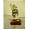 Image 1 : Whales tooth scrimshawed with sailing ship and whale and harpoon mounted on wood 6.75" tall retail v