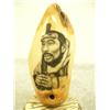Image 2 : Fossilized whale tooth mounted on wood scrimshawed with Eskimo man holding gun with snow goggles 5" 