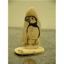 Ivory bark scrimshawed with puffin mounted on ivory by Homer Cole signature 4" tall retail value $32
