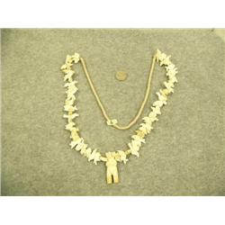 Ivory necklace with bear pendant and various animal carvings: rabbit, birds, bears, squirrel, foxes,