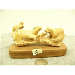 4 otters carved from bone with 4 salmon mounted on wood by G.E.G. 5" wide 3" tall (33)