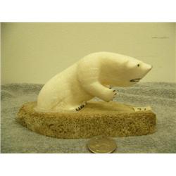 Carved ivory polar bear mounted on bone 3.25" tall 6.25" long retail value $425.00 (33)
