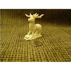 Carved ivory reindeer by C.i.j.w.- 2-1/8" (74)