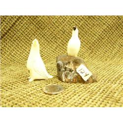 Lot of 2: Ivory sea bird 2.25" and ivory sea bird mounted on fossilized ivory by Harrison Iyakitan 2
