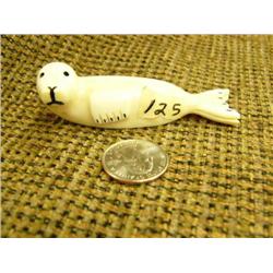 Carved ivory seal by Milton Apassingok 1" tall 3.5" long (74)