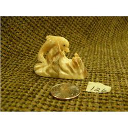 Fossilized ivory dolphin 1.5" tall (74)