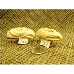 Lot of 2: fossilized ivory teeth mounted on wood: relief carved rams head 2.25" and relief carved ea