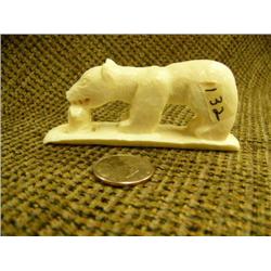 Carved ivory of polar bear catching a seal by Doug Silook 1.75" tall 3.75" long (74)