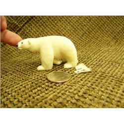 Ivory polar bear with inset baleen eyes 1.5" tall 2.75" long (74)