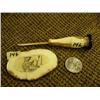 Image 1 : Lot of 2: Scrimshawed fossilized ivory with Eskimo man ice fishing by Arnie Iyakitan and fossilized 
