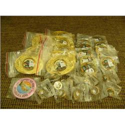 1990 Fur Rondy Memorabilia -10 men's belt buckles, 11 pins, 11 tie tacks, 1 booster button (154)