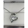 Image 1 : Floating Solitaire in Heart with bezel set stones Pendant & Chain