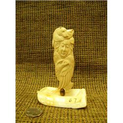 Bone intricate Native carving with face, bear, fish and eagle on ivory base 5" tall by Richard Mille