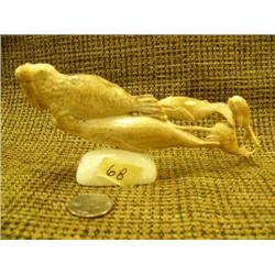 Bone carving on ivory base of a walrus and whales 7" wide signed Imported (33)
