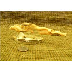 Beautiful caramel fossilized walrus ivory and ivory chips on bone base with whale, mermaid and 2 sal