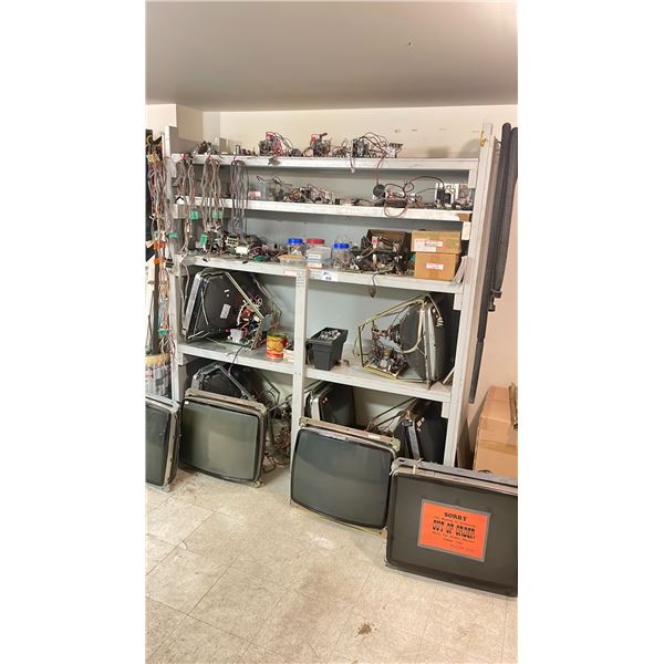 SHELF OF ASSORTED ARCADE MACHINE CABLES, BOARDS, & PARTS