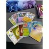 Image 2 : Lot of 1 Pokemon Storage Tin with Assorted Authentic Pokemon Cards, Mini Binder, Playing Dice, etc.