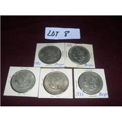 (4) 1886 Morgan silver dollars (1) 1888 Morgan Silver dollars