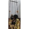 Image 1 : Native American kissing dolls on a swing