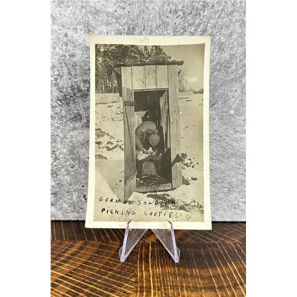 German Soldier Picking Cooties RPPC Postcard