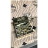 Image 2 : BLACK AND CREAM MCM CLUTCH WITH CHAIN STRAP AND GOLD DETAILS - AUTHENTICITY UNKNOWN