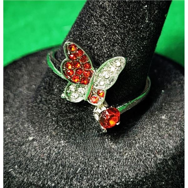 15)  RED ZIRCON BUTTERFLY SIZE 8 RING, WITH CLEAR