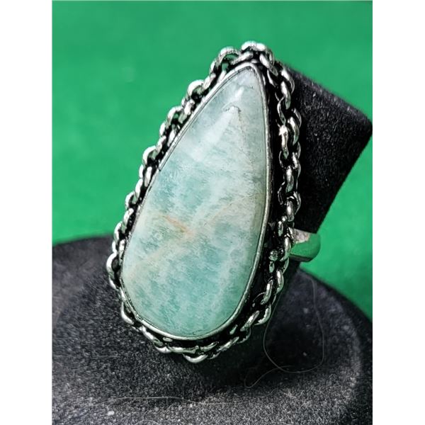 19)  NATURAL PEAR SHAPED LARIMAR SIZE 5.25 RING WI