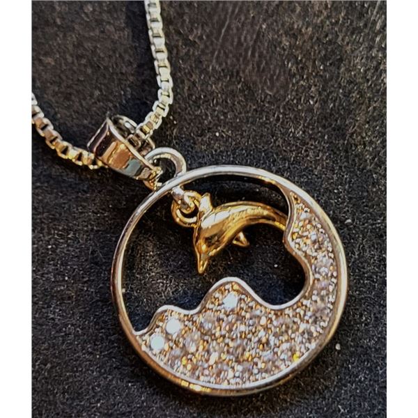 14)  SILVER TONE WITH GOLD ACCENTS DOLPHIN AND CLE