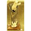 Image 1 : 13" mammoth bone mounted on wood base with 2 four inch whale bone bears by C. Olinanna (25)