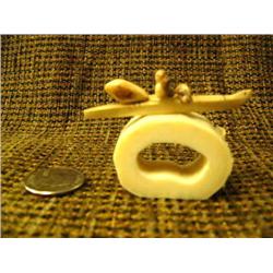 2.5" fossilized ivory kayaker with seal by Thomas Pushruk from king island in 2005